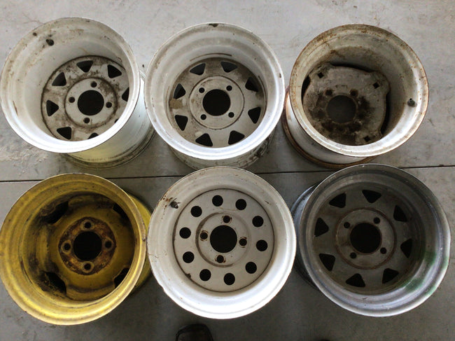 Used assortment of 4 bolt lawn mower rims